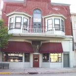 old building with bay windows second floor