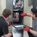 electricians looking at box