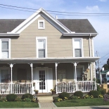 tan house with front porch